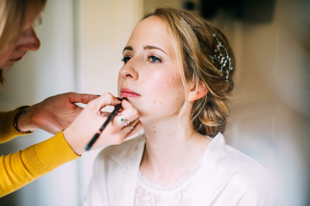 Bride having her bridal makeup done by Bristol makeup artist Evie Smith.