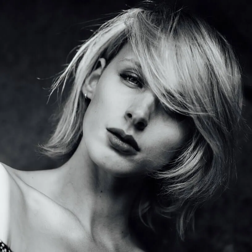 Black and white photo of a model with makeup by Bristol makeup artist Evie Smith.