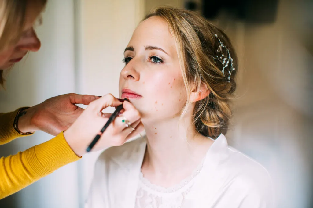 Bride having her bridal makeup done by Bristol makeup artist Evie Smith.
