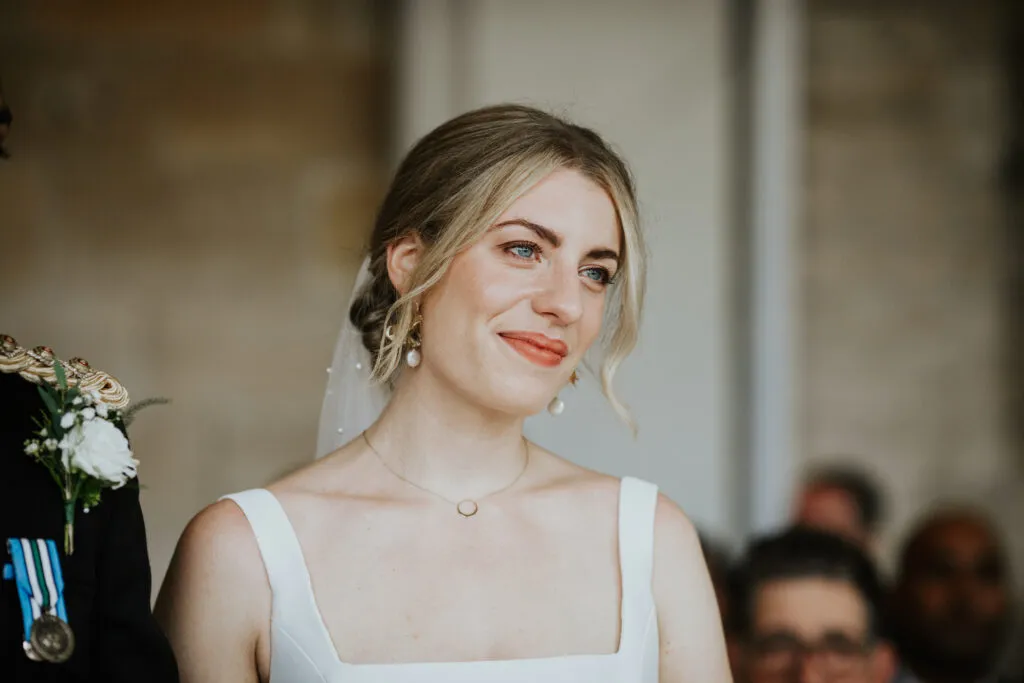 Smiling bride during their wedding ceremony.
