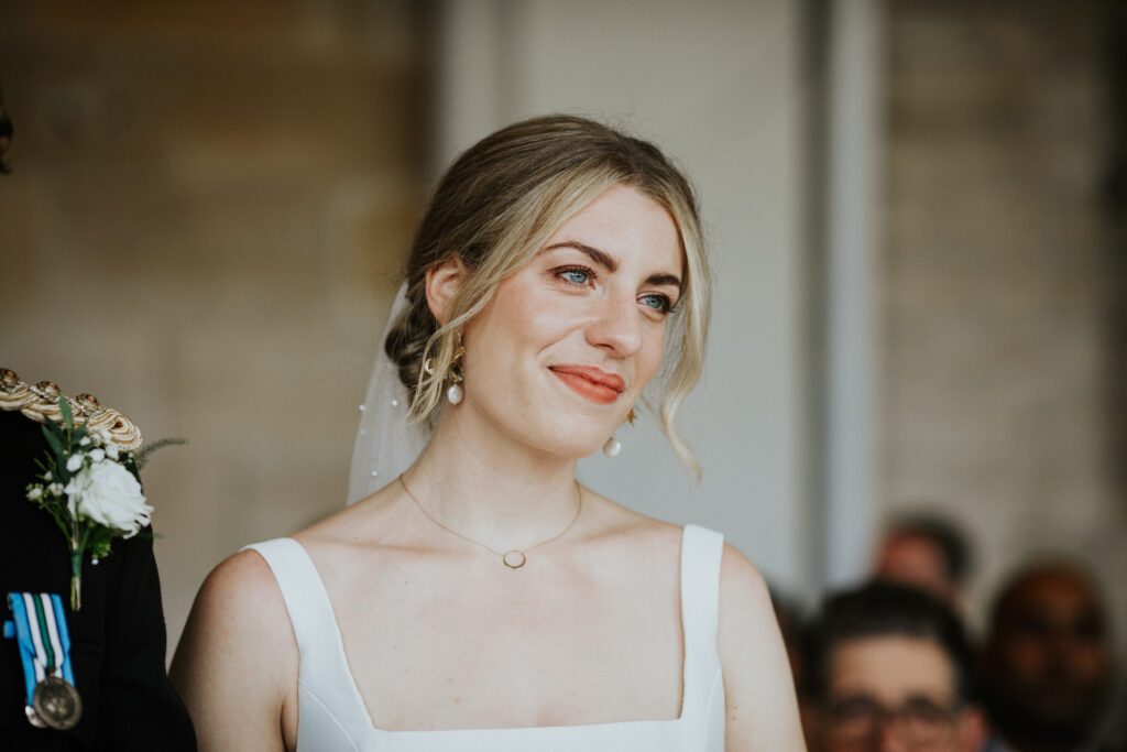 Smiling bride during their wedding ceremony.