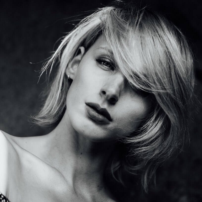 Black and white photo of a model with makeup by Bristol makeup artist Evie Smith.